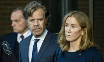 ‘I guess I’m still processing’ … Huffman with her husband William H Macy leaving court in 2019.