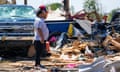 A man looks over debris after a deadly tornado hit Texas