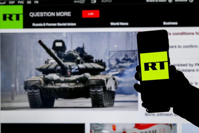 RT logo on a smartphone screen.