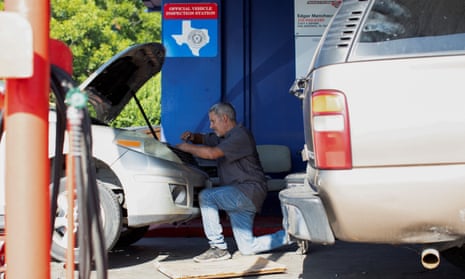 Heat wave in the city of San AntonioMike Garza works on a vehicle outside of EMS Mechanic & Tire Shop, which consists of a few shaded areas but does not have any access to air conditioning, during a period of hot weather in San Antonio, Texas, U.S. June 27, 2023.