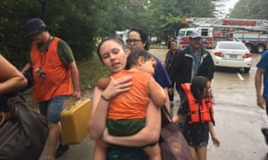 Claire Torres leads her family to shelter in Woodlands