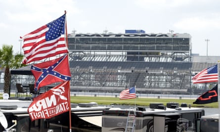 American, Confederate and NRA flags fly on top of motor homes at the Daytona International Speedway in July 2015.