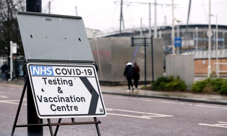 A sign for a Covid testing and vaccination centre.
