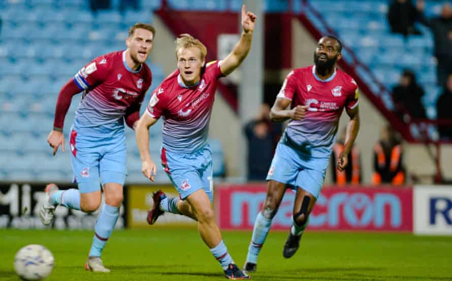 Jake Scrimshaw celebrates after scoring Scunthorpe’s equaliser last week in a draw with Leyton Orient. The team have been harder to beat under Keith Hill.