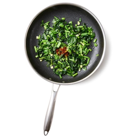 Felicity Cloake’s borek 02a. Put a tablespoon of the oil in a frying pan over a medium heat, then fry the onions, stirring, for about 10 minutes, until softened. Add the spinach and salt, turn up the heat slightly and fry, stirring, until completely wilted and dried out (if using defrosted spinach, cook just until it’s well mixed in and dry).