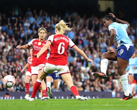 Manchester City’s Bunny Shaw scores the fourth goal to seal victory over Arsenal and top spot in the WSL.