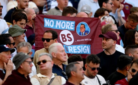 A fan of West Ham holds a banner which reads ‘No More BS Just Resign’ with a cartoon of David Sullivan during a match last month against Leeds United in London.