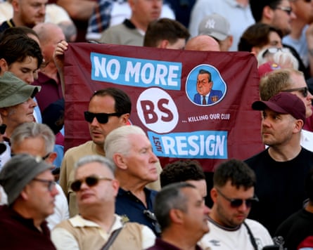West Ham fans hold up a banner in the club’s colours that reads ‘No more BS. Just resign’