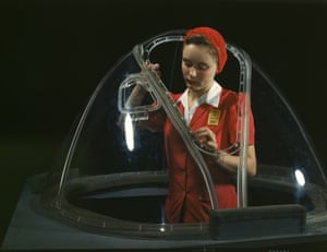 Eighteen-year-old Phyllis Ann Marxson Clark, from North Dakota, puts the finishing touches to the bombardier nose section of a B-17F in October 1942.