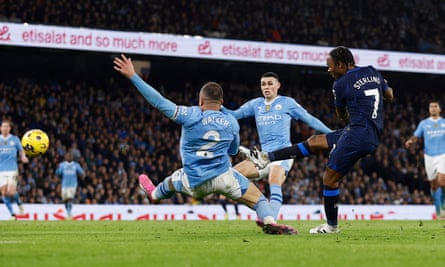 Chelsea's Raheem Sterling scores the opener against Manchester City.