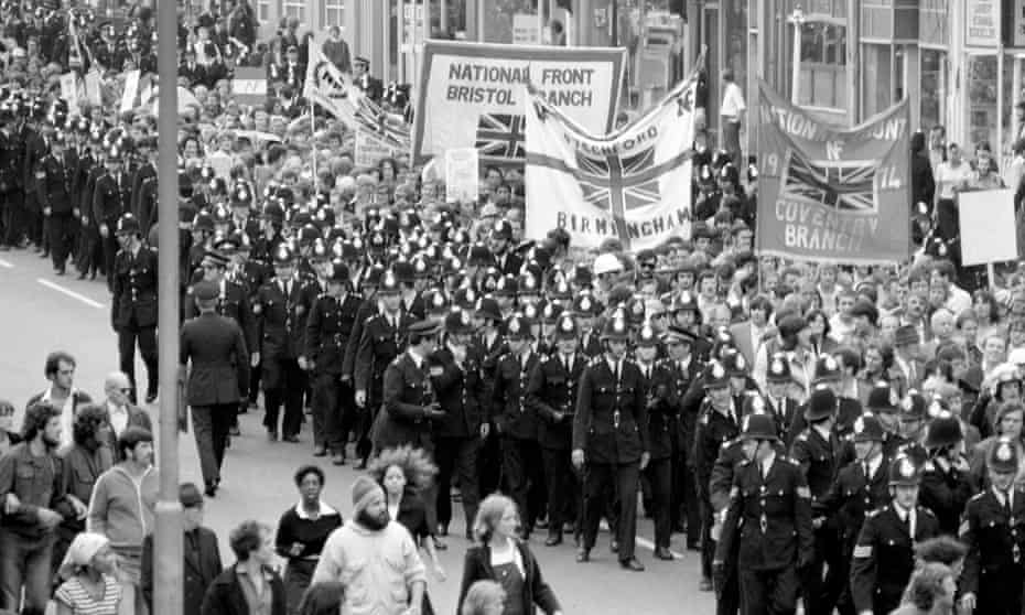 Police officers escort a National Front rally through Lewisham on 13 August 1977.