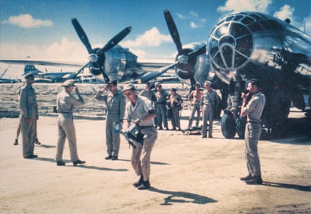 Pilot Paul Tibbets receives a medal moments after landing the Enola Gay after the Hiroshima mission.
