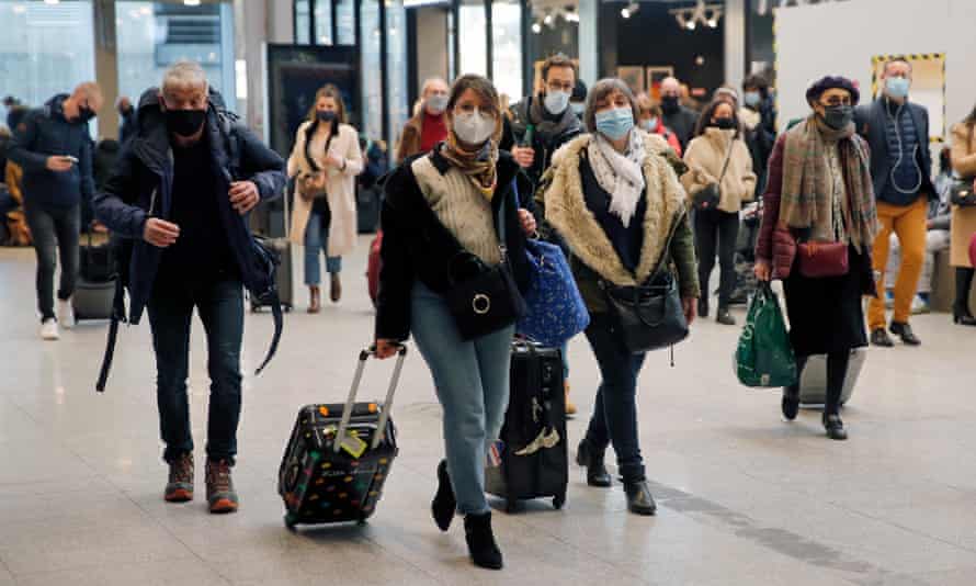 Passengers prepare to board a train at Montparnasse railway station to go to the provinces to avoid the third lockdown in France last week.