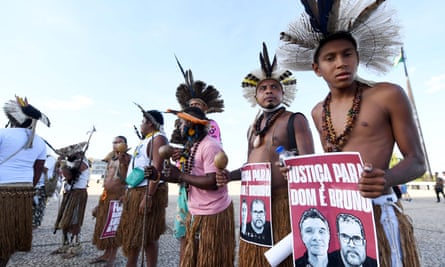 Indigenous people of different ethnicities demand justice for the murder of British journalist Dom Phillips and Brazilian indigenist Bruno Pereira and for land rights, outside the supreme court in Brasília.