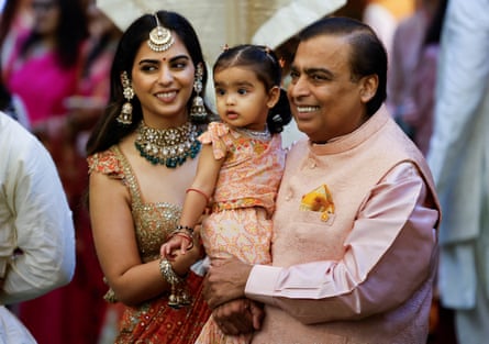 Mukesh Ambani poses for a picture with his daughter Isha Ambani.