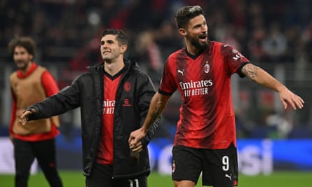 Olivier Giroud and Christian Pulisic of Milan celebrate after beating PSG.