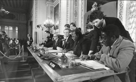 Robert Mugabe signs the Lancaster House peace agreement in 1979, which allowed for the creation and recognition of Zimbabwe.