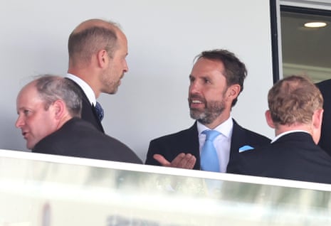 Sir Gareth Southgate discusses football tactics with an Aston Villa supporter.
