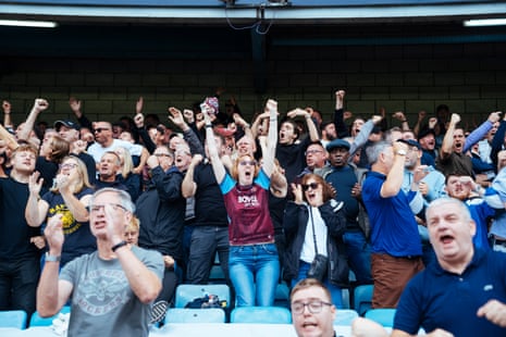 West Ham supporters celebrate a goal.