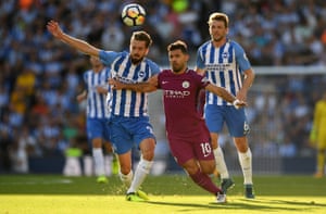 Manchester City’s Sergio Aguero holds off Brighton’s Davy Propper. Aguero opened the scoring as City won 2-0 at the Amex to overcome newly promoted Brighton.