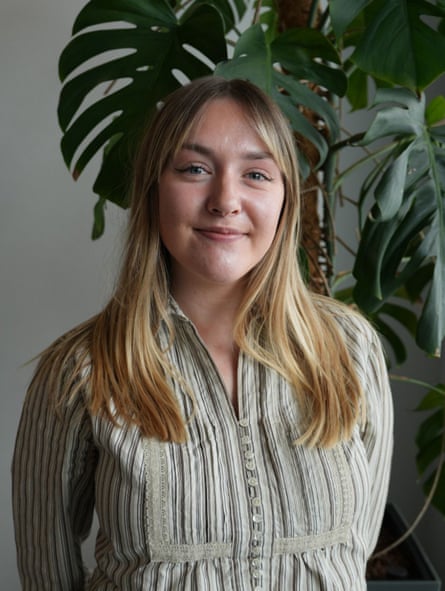 Charlotte Smith stands in front of a plant