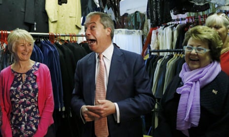 Ukip leader Nigel Farage talks with supporters at a small business in Canterbury.