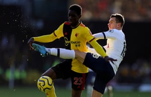 Ismaila Sarr of Watford battles with Giovani Lo Celso of Tottenham Hotspur.