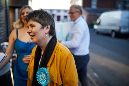 Fox wearing a Brexit party rosette speaking to someone off-camera