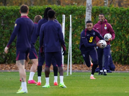 England’s Ezri Konsa runs with a ball in his hands during training.