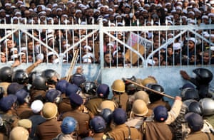 Students of Darul Uloom Nadwatul Ulama are stopped by police during a protest against a new citizenship law. Lucknow, India