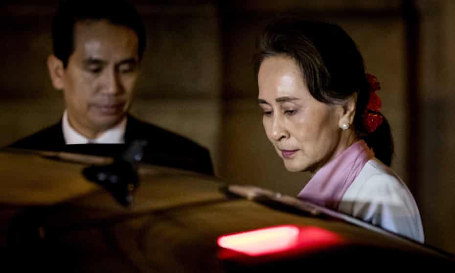 Aung San Suu Kyi leaves the Peace Palace after the third day of hearings on the Rohingya genocide case in the Hague, the Netherlands, on Thursday