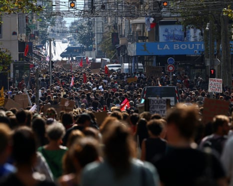 Protesters march during a demonstration by French high school and university students in Marseille as part of a nationwide day of protests and blockades.