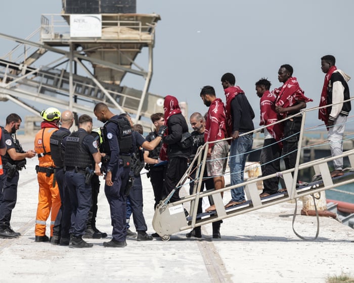 Dinghy carrying 173 people capsizes in Channel after engine catches fire — image supplied by The Guardian UK's feed