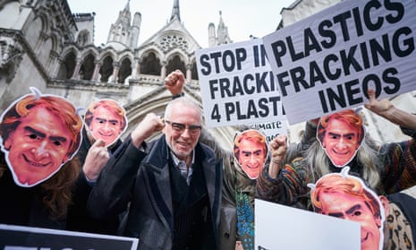 Protesters wearing masks of Ineos CEO Jim Ratcliffe at the high court in London.