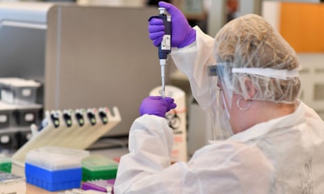 A lab worker extracts DNA in New York.