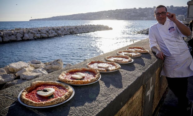Italian chef Gino Sorbillo with pizza spelling out ‘Unesco’ in Naples