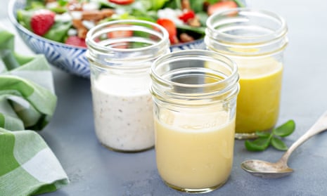 Variety of salad dressings in glass jars with ranch, italian and honey mustard