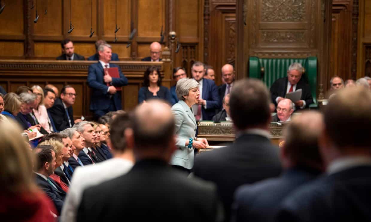 Theresa May delivers a speech to a full house in parliament.