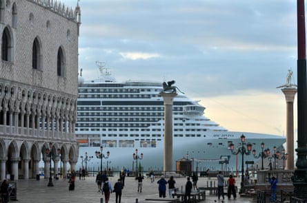 A cruise ship passes in front of San Marco Square in Venice.