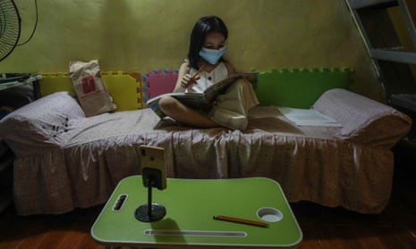 Kylie Larrobis, an incoming first grade student, studies at her home in Quezon City, suburban Manila, ahead of another school year of remote lessons in the Philippines due to the pandemic. 