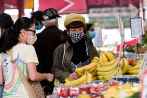 Locals shop for fresh food in the Queen Victoria Market in Melbourne at the weekend