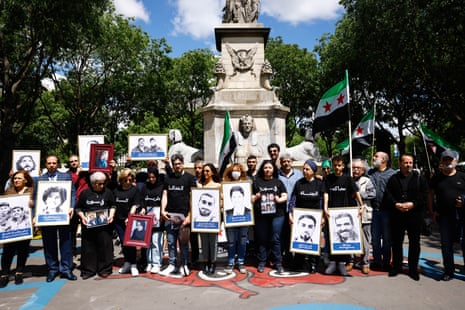 Syrian activists demonstrate during the trial in Paris on Tuesday.