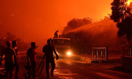 Firefighters battle a blaze in Mulga, Turkey, last week