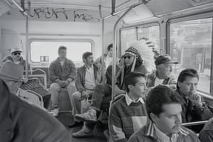 Man in a headdress on a bus.