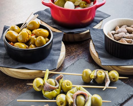 Different types of spanish tapas, banderillas, gildas, olives and almonds