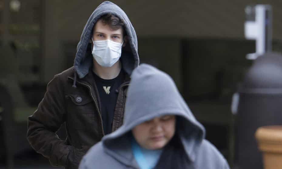 A man wearing a mask in Kirkland, Washington. Washington state is currently at center of US outbreak of coronavirus, with 27 confirmed cases.