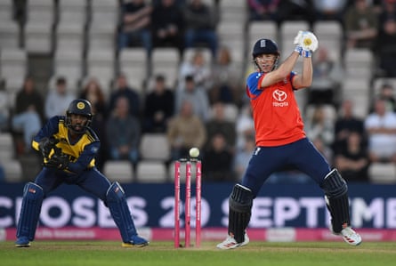 Harry Brook hits out during his unbeaten 114 for England against Sri Lanka, watched by the wicketkeeper, Kamil Mishara.