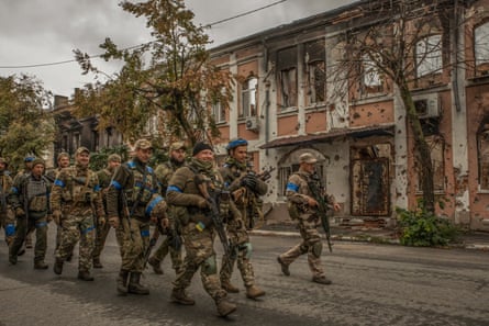 Soldiers marching on a street