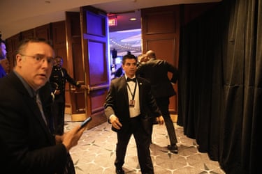 Security and official personnel take charge after shots fired during the dinner.