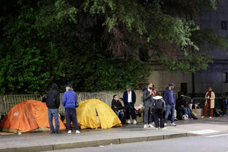 People gather outside the court as they wait for the sentencing hearing of Sean "Diddy" Combs.